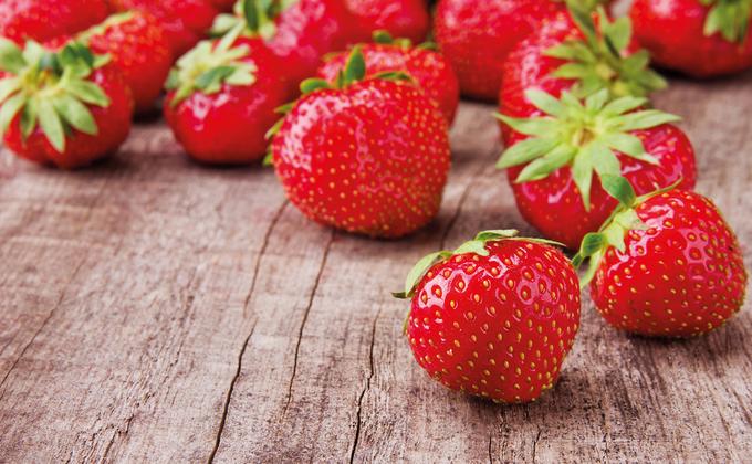 Fresh strawberries on wooden background