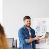 young man holding presentation for colleagues