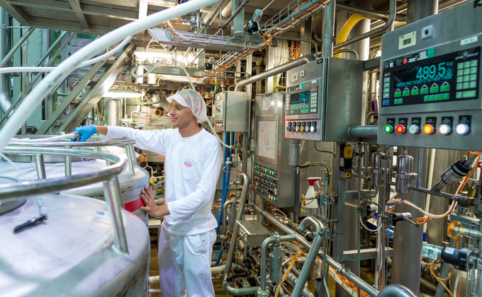 Employee checking production process; Gleisdorf Austria